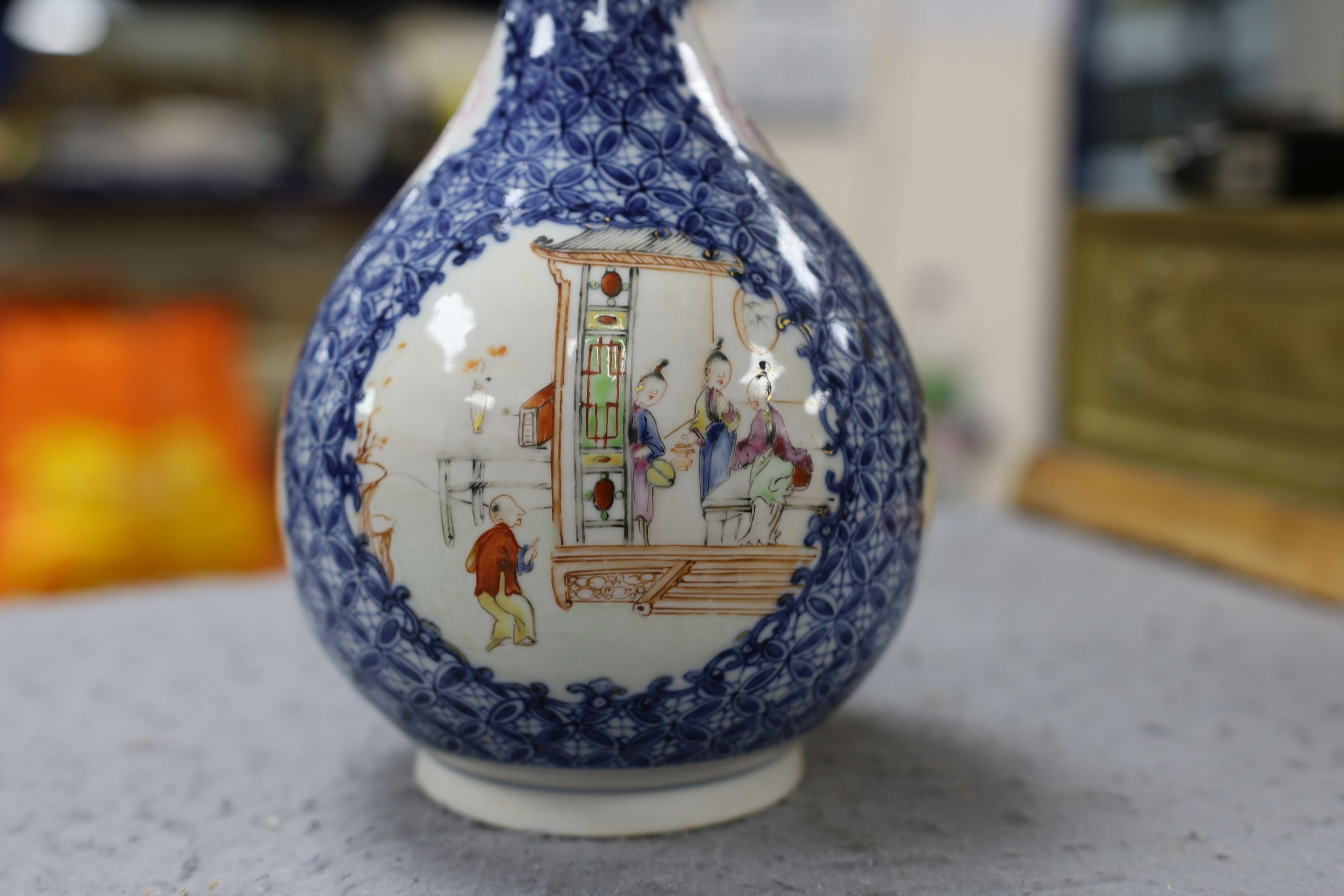 A pair Samson of Paris vases in the Chinese famille verte style and a Chinese Qianlong famille rose garlic neck vase with blue panelling motif, tallest 26cm